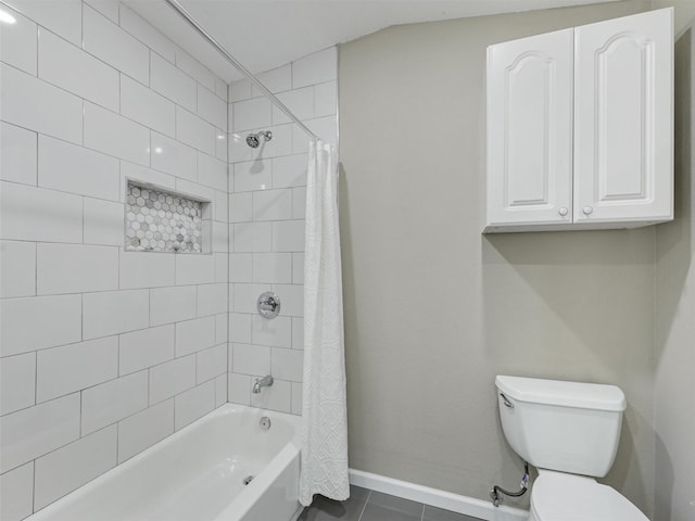 bathroom featuring toilet, shower / bath combo, and tile patterned flooring