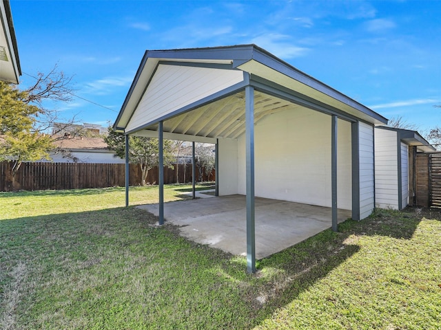 exterior space featuring a yard and a carport