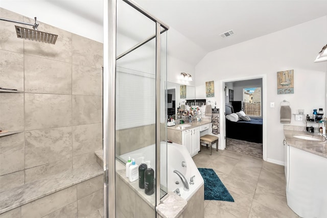 bathroom featuring vanity, separate shower and tub, and vaulted ceiling