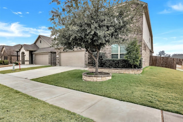 view of front of home with a garage and a front yard