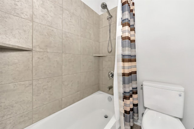 bathroom featuring shower / bathtub combination with curtain and toilet