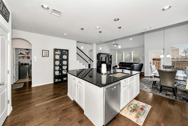 kitchen with sink, dark wood-type flooring, dishwasher, a kitchen island with sink, and white cabinets