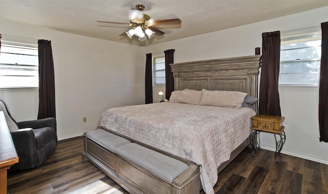 bedroom featuring dark hardwood / wood-style flooring and ceiling fan