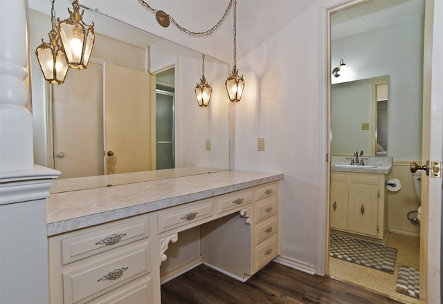 bathroom with hardwood / wood-style flooring and vanity