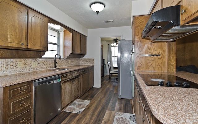 kitchen with sink, stainless steel appliances, dark hardwood / wood-style flooring, decorative backsplash, and exhaust hood