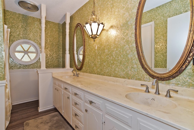 bathroom with hardwood / wood-style flooring and vanity