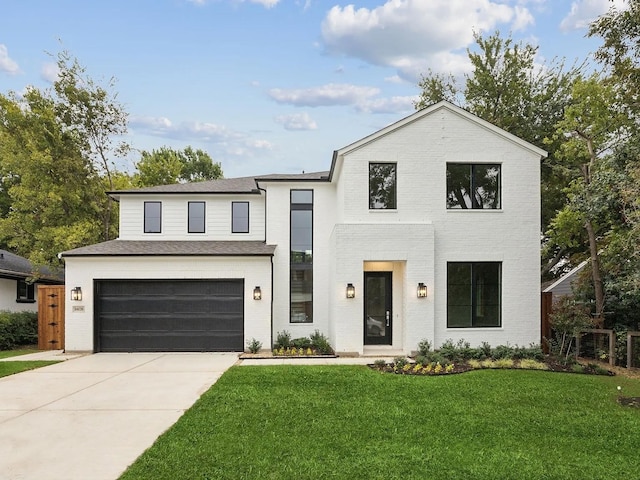 410 Kirkwood Dr, Dallas, TX 75218 - view of front of home featuring a garage, a front yard, driveway, and brick siding