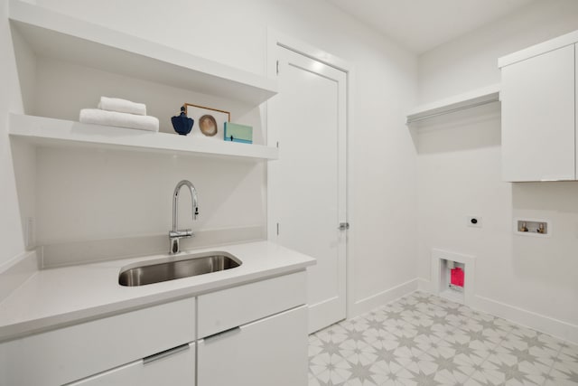 410 Kirkwood Dr, Dallas, TX 75218 - washroom with electric dryer hookup, light floors, hookup for a washing machine, and cabinet space