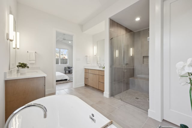 bathroom with tile patterned floors, walk in shower, lofted ceiling, and vanity