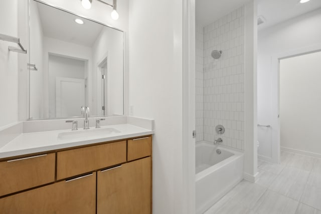 410 Kirkwood Dr, Dallas, TX 75218 - bathroom featuring vanity, bathtub / shower combination, tile patterned floors, and recessed lighting