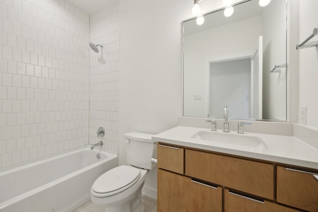 bathroom featuring washtub / shower combination, vanity, and toilet