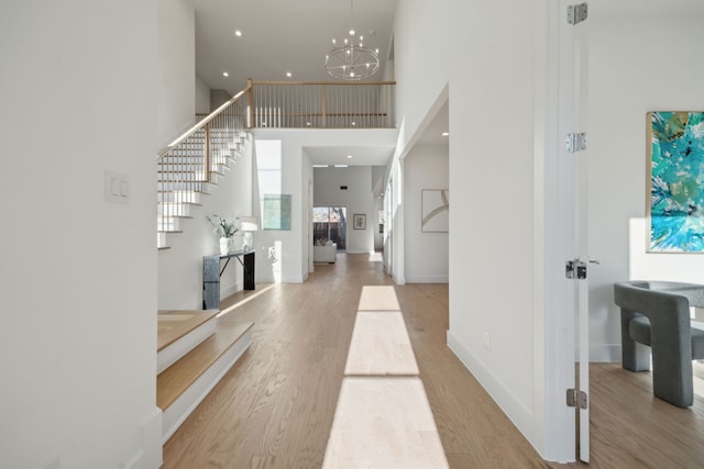 410 Kirkwood Dr, Dallas, TX 75218 - entryway with a high ceiling, stairs, wood finished floors, a chandelier, and recessed lighting
