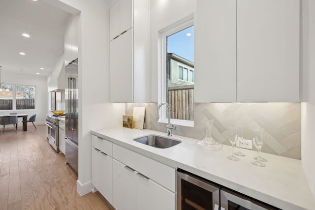 410 Kirkwood Dr, Dallas, TX 75218 - kitchen featuring modern cabinets, white cabinets, and recessed lighting