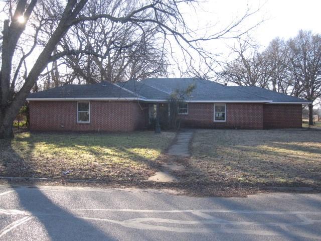 ranch-style house with a front lawn