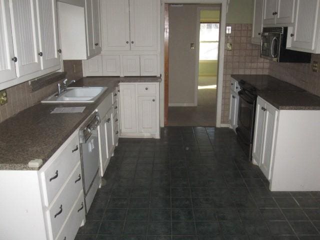 kitchen with white cabinets, tasteful backsplash, sink, black electric range, and white dishwasher