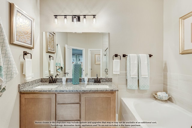 bathroom featuring vanity and a bathing tub