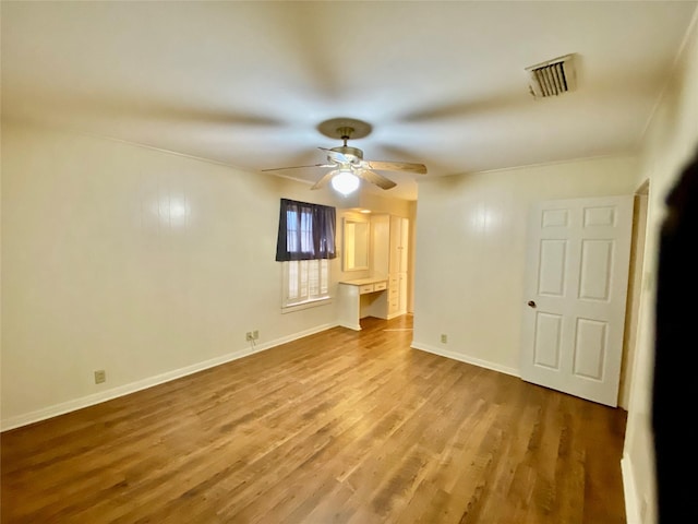 interior space featuring hardwood / wood-style floors and ceiling fan