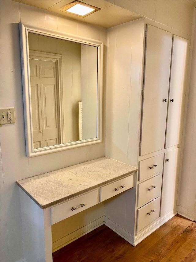 mudroom featuring dark hardwood / wood-style flooring and built in desk