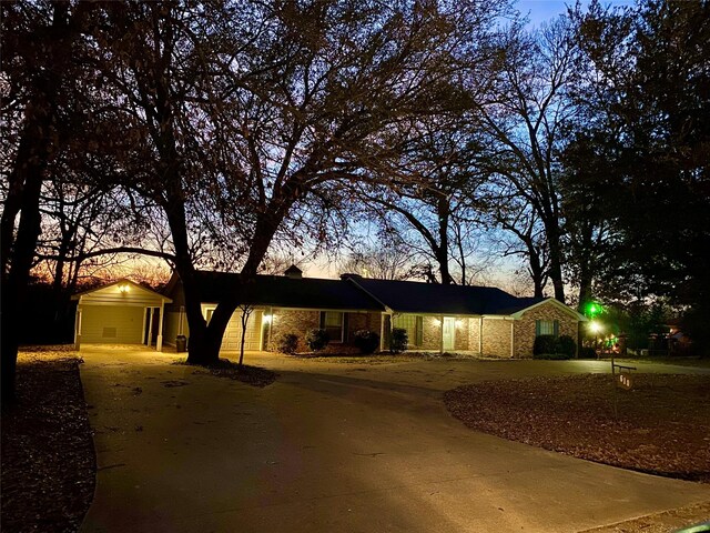 610 Tamy St, Quitman, TX 75783 - ranch-style home featuring concrete driveway, an attached carport, and brick siding