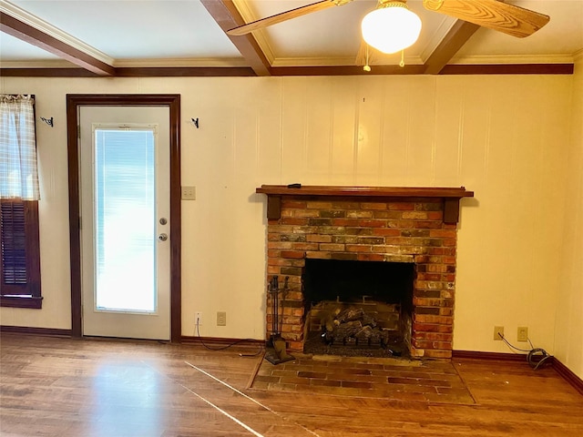 unfurnished living room featuring wood-type flooring, beam ceiling, and ornamental molding