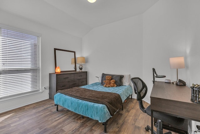 bedroom with dark wood-type flooring and vaulted ceiling