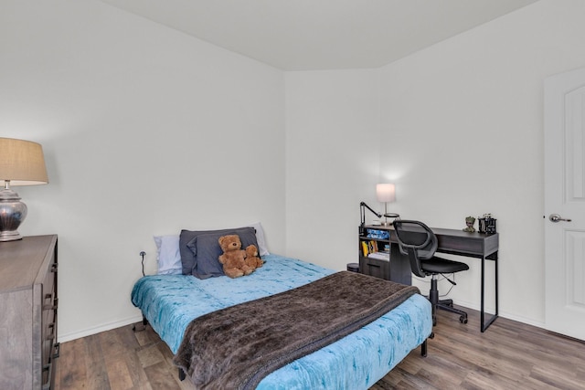 bedroom featuring hardwood / wood-style flooring