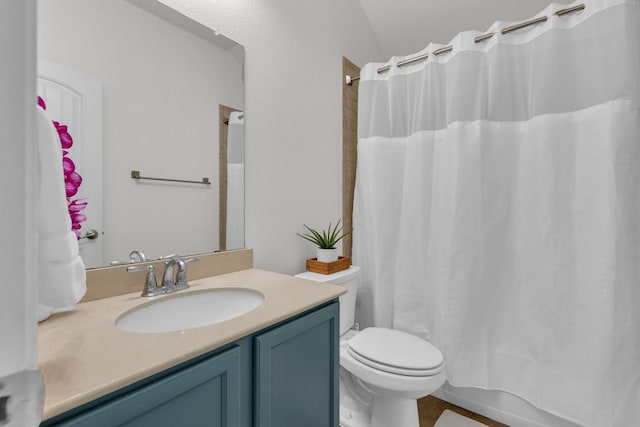 full bathroom featuring toilet, shower / tub combo with curtain, vaulted ceiling, and vanity