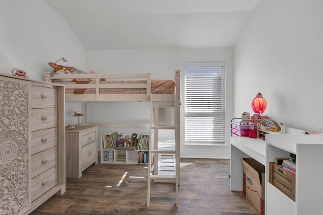 bedroom featuring vaulted ceiling and dark hardwood / wood-style floors