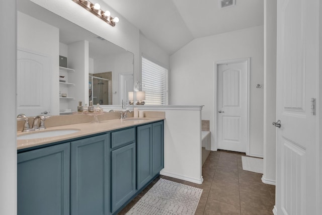 bathroom with independent shower and bath, vaulted ceiling, vanity, and tile patterned flooring