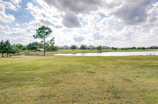 view of yard with a gazebo and a water view