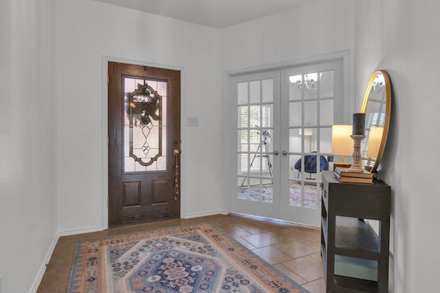 tiled entrance foyer featuring french doors