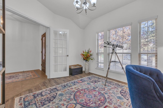 office featuring a notable chandelier, vaulted ceiling, and hardwood / wood-style floors