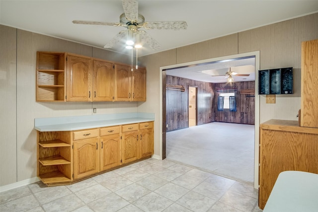 kitchen with light carpet and ceiling fan