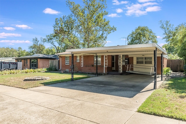 single story home featuring a front yard and a carport