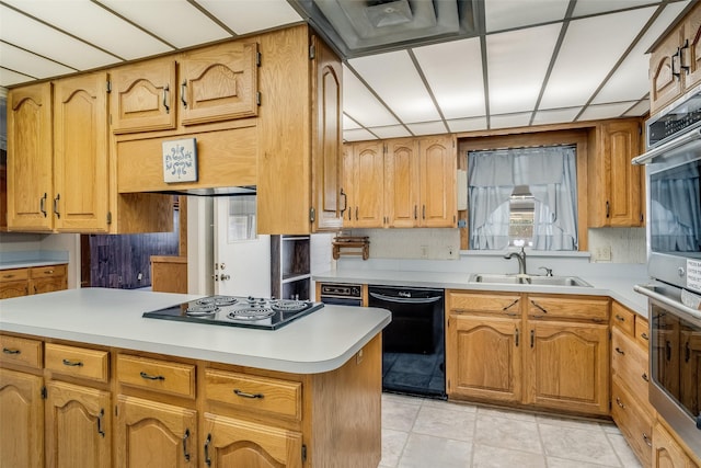 kitchen with sink, a wealth of natural light, backsplash, and black appliances