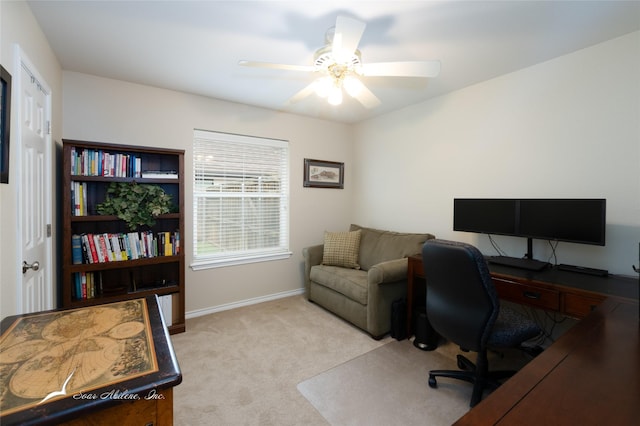 carpeted home office with ceiling fan