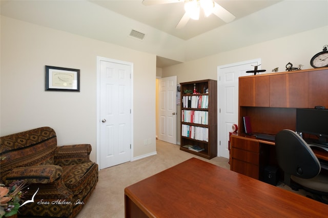 carpeted office space with ceiling fan