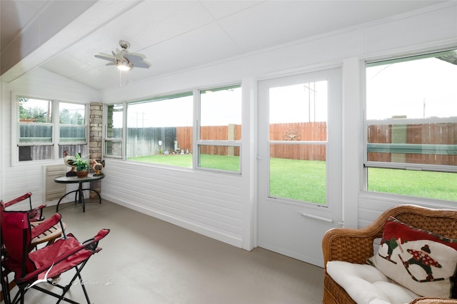 sunroom / solarium featuring lofted ceiling and ceiling fan