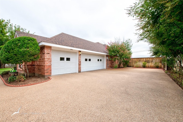 view of side of property with a garage