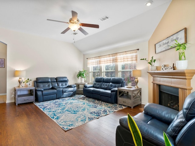 living room with ceiling fan, dark hardwood / wood-style floors, and lofted ceiling