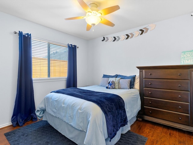 bedroom featuring ceiling fan and dark hardwood / wood-style flooring