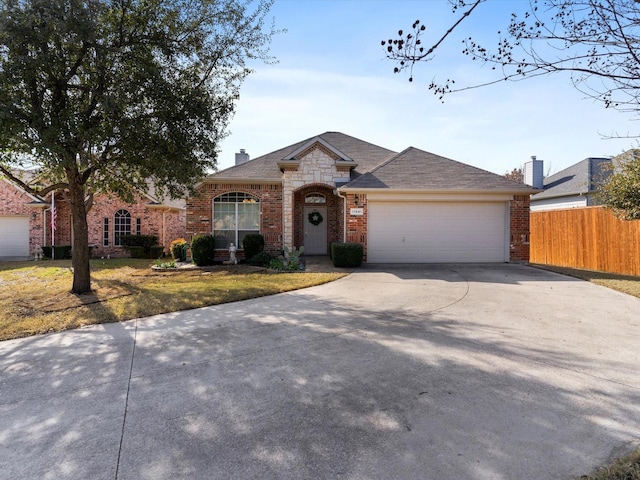 view of front facade featuring a garage and a front lawn