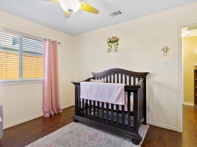 bedroom featuring ceiling fan and dark hardwood / wood-style flooring