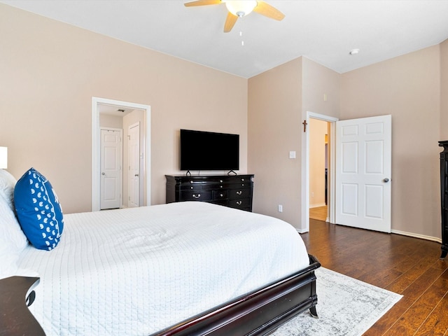 bedroom with ceiling fan and dark hardwood / wood-style floors