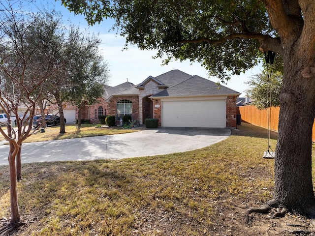 ranch-style home featuring a garage and a front lawn