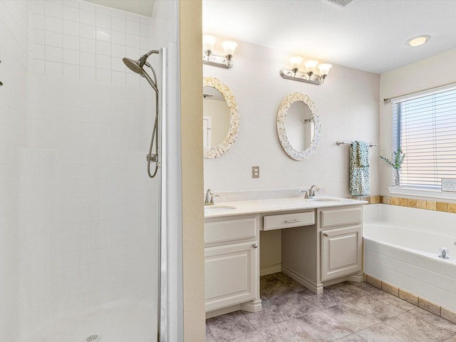 bathroom featuring vanity, shower with separate bathtub, and tile patterned floors