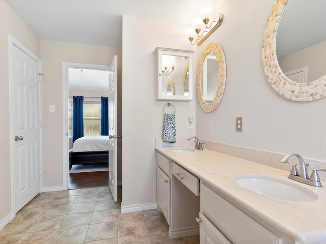 bathroom with vanity and tile patterned flooring