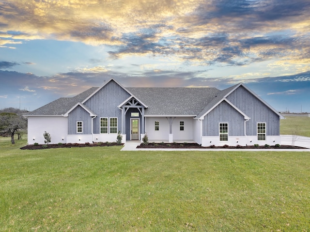 view of front of property with a lawn