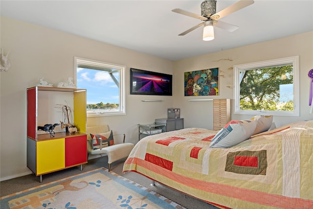 carpeted bedroom with ceiling fan