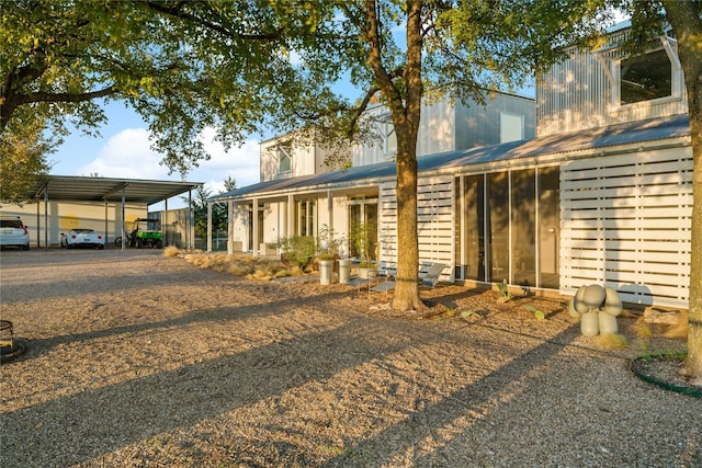 view of front of home with a carport